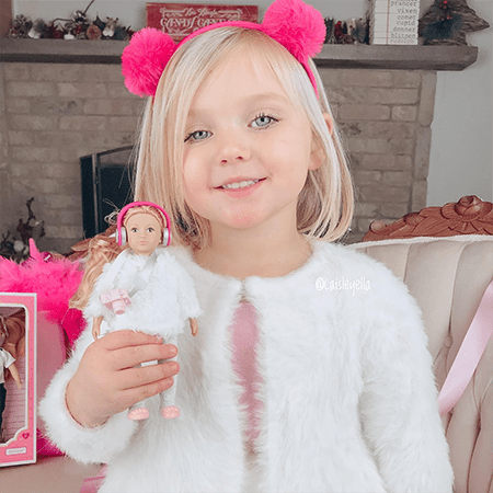 Girl with mini doll.