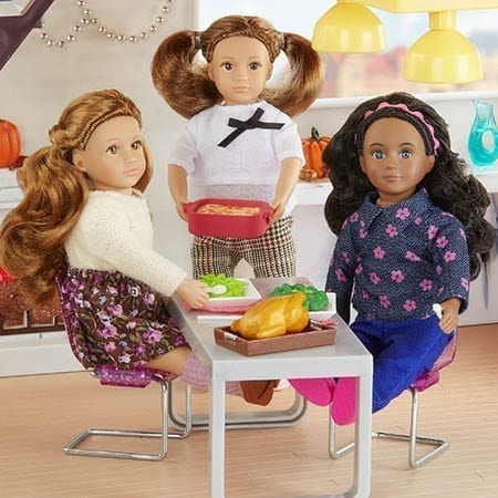 Three dolls having dinner.