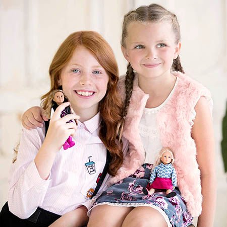 Girls with mini dolls.