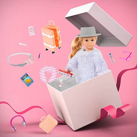 Doll and accessories popping out of box.