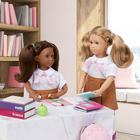 Two student dolls in school.