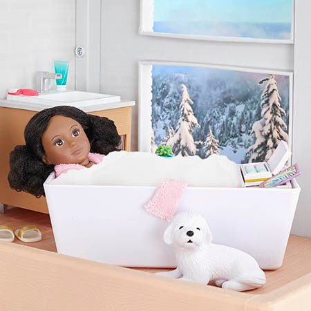 Mini doll in tub.