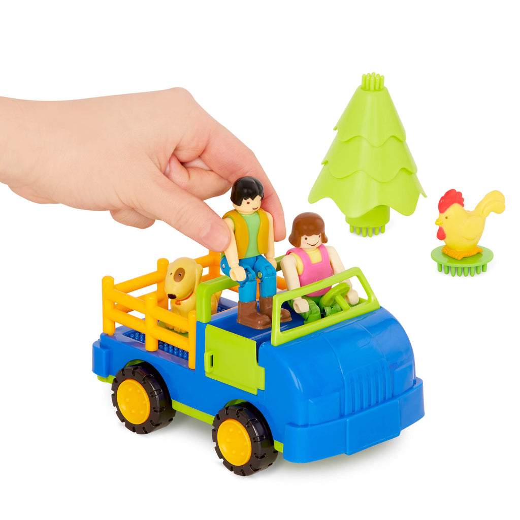 A 67-piece building block set with a farm theme, the set is laid out to show all the pieces, including animals, trees, and tractor.