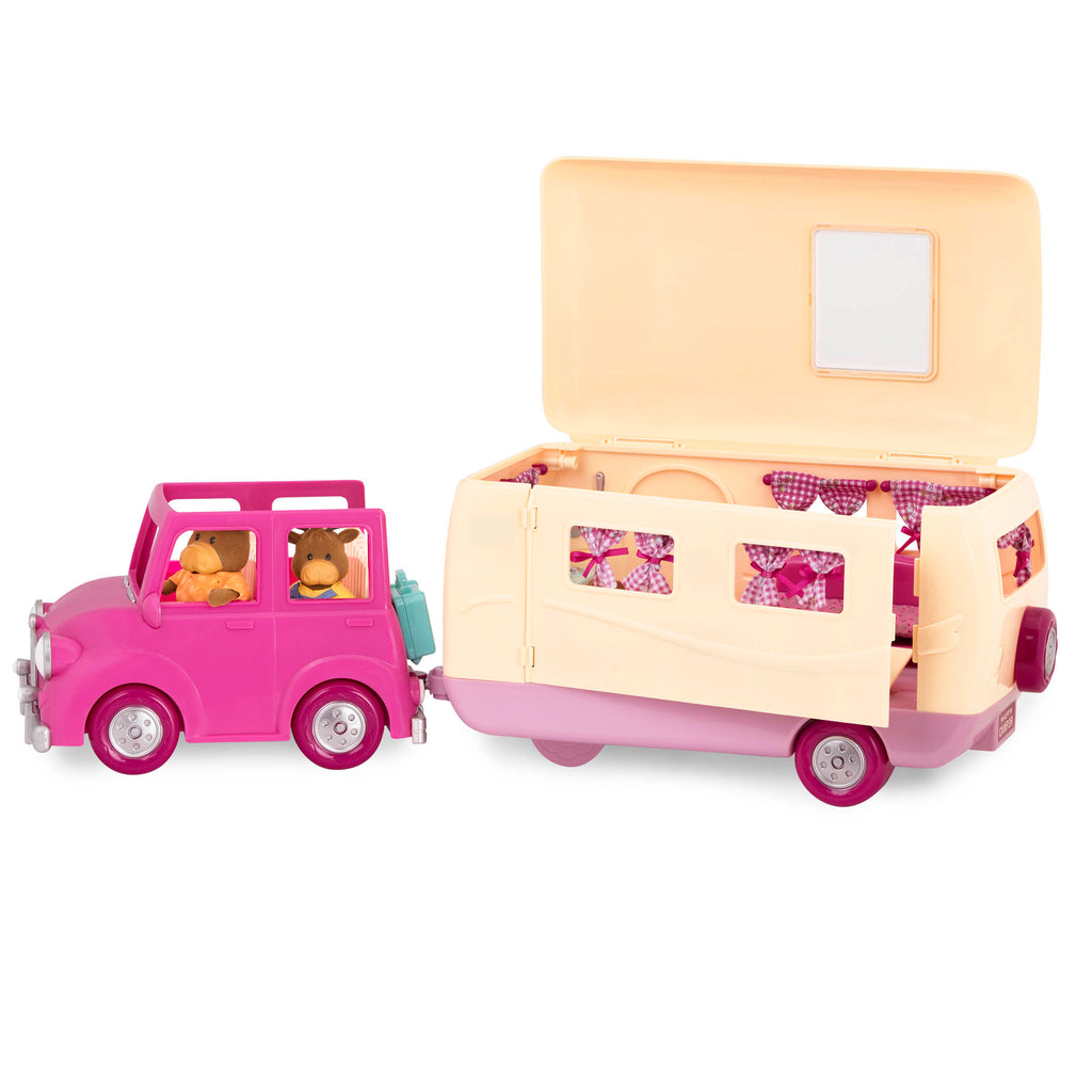 Toy camper playset with pink car and moose family inside.
