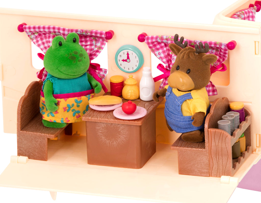 Toy camper playset with pink car and moose family inside.