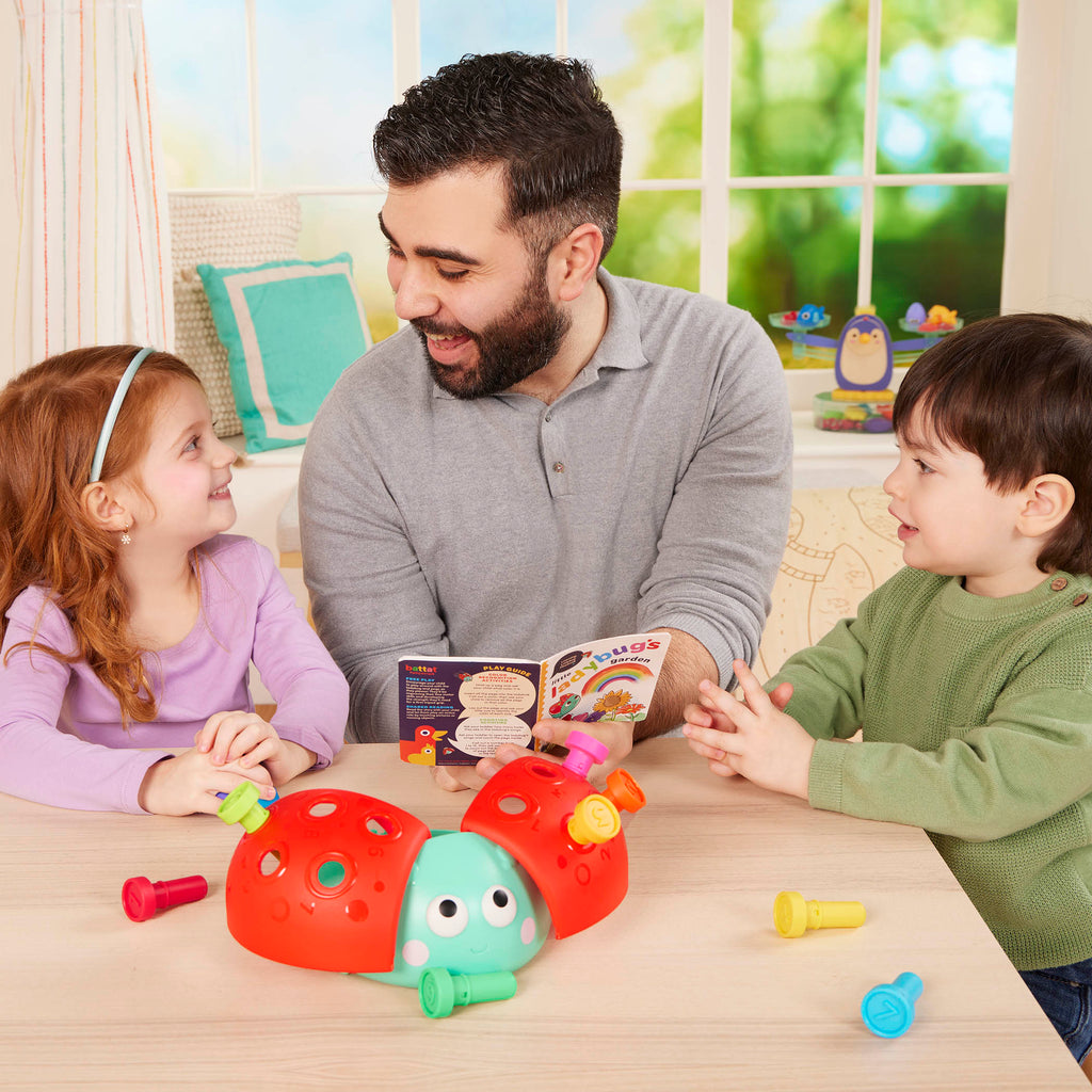 Colorful ladybug peg toy with booklet.