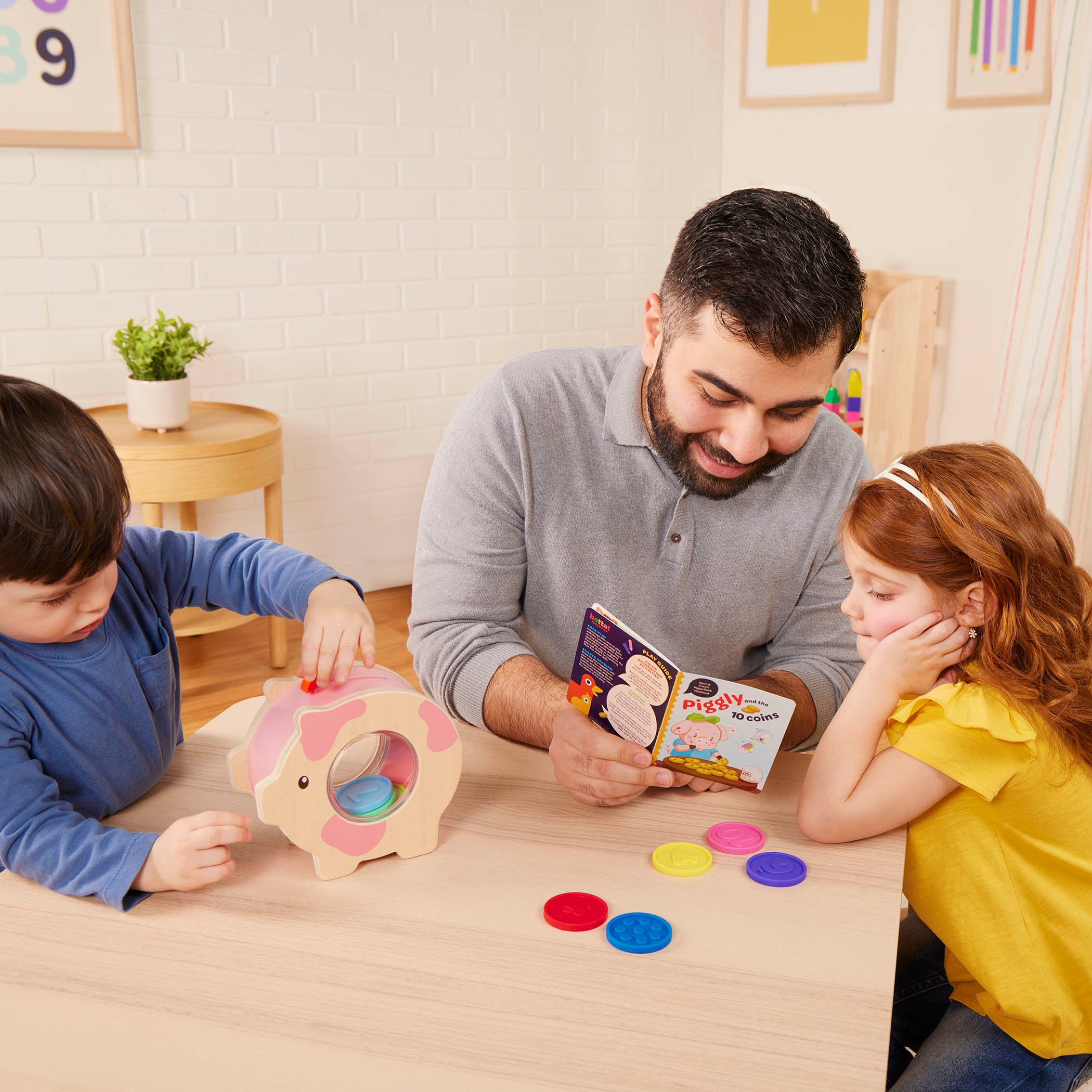 Piggy bank toy with colorful play coins and booklet.