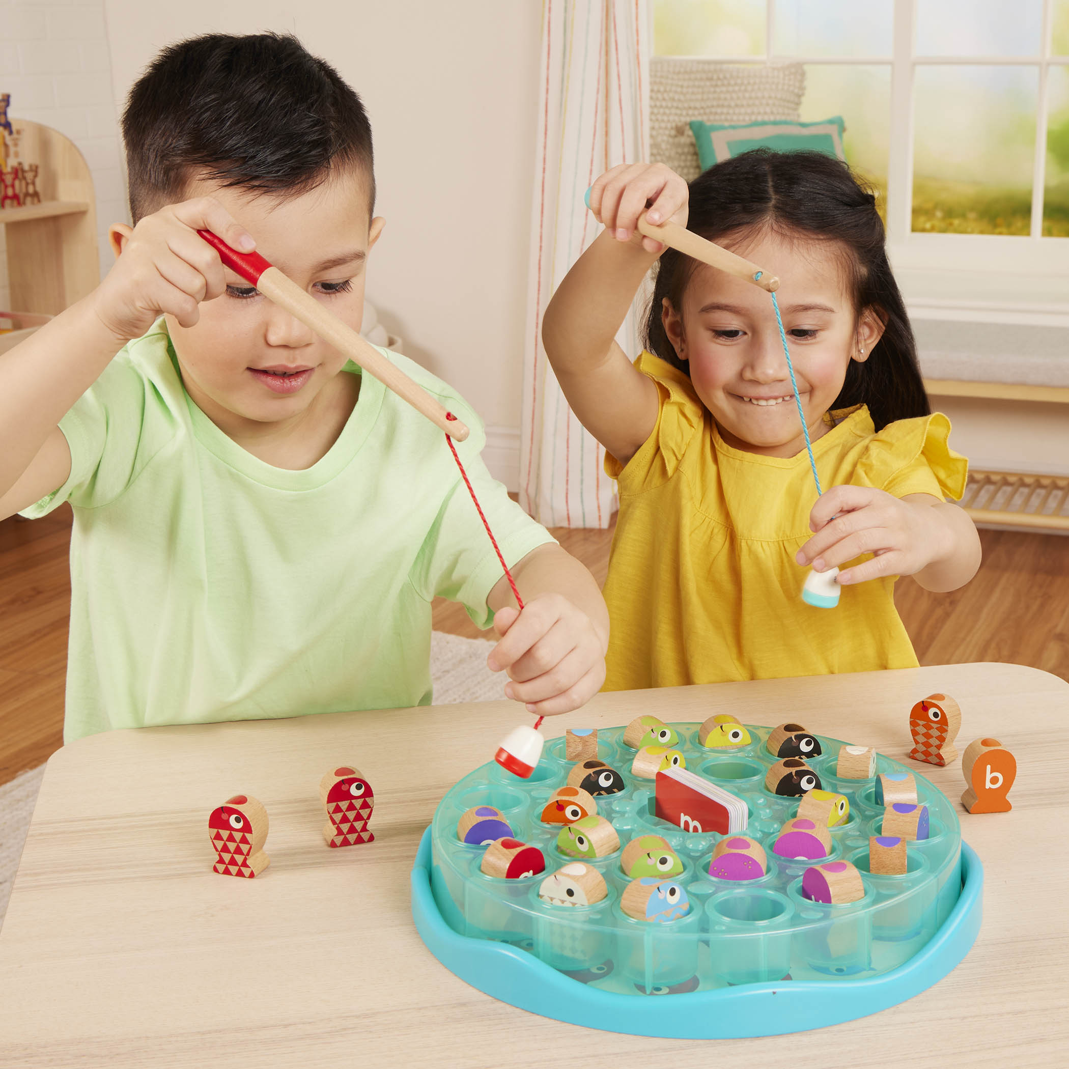 Colorful fishing playset with wooden fish toys, magnetic fishing rod toys, alphabet cards and a game board.