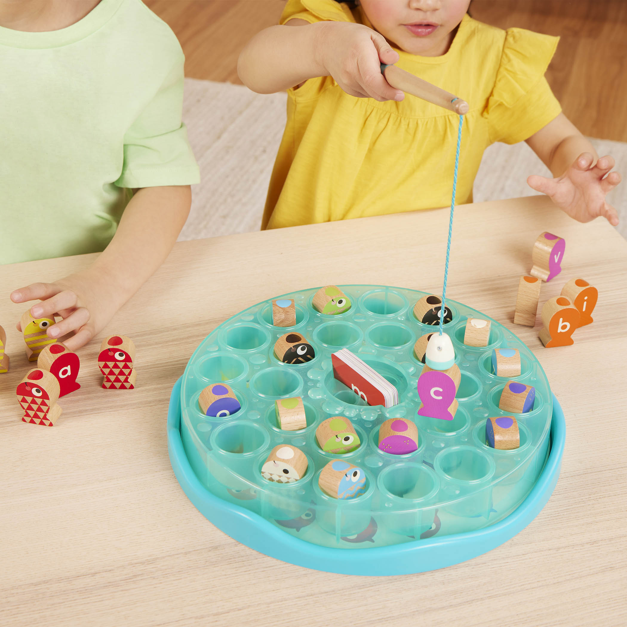 Colorful fishing playset with wooden fish toys, magnetic fishing rod toys, alphabet cards and a game board.