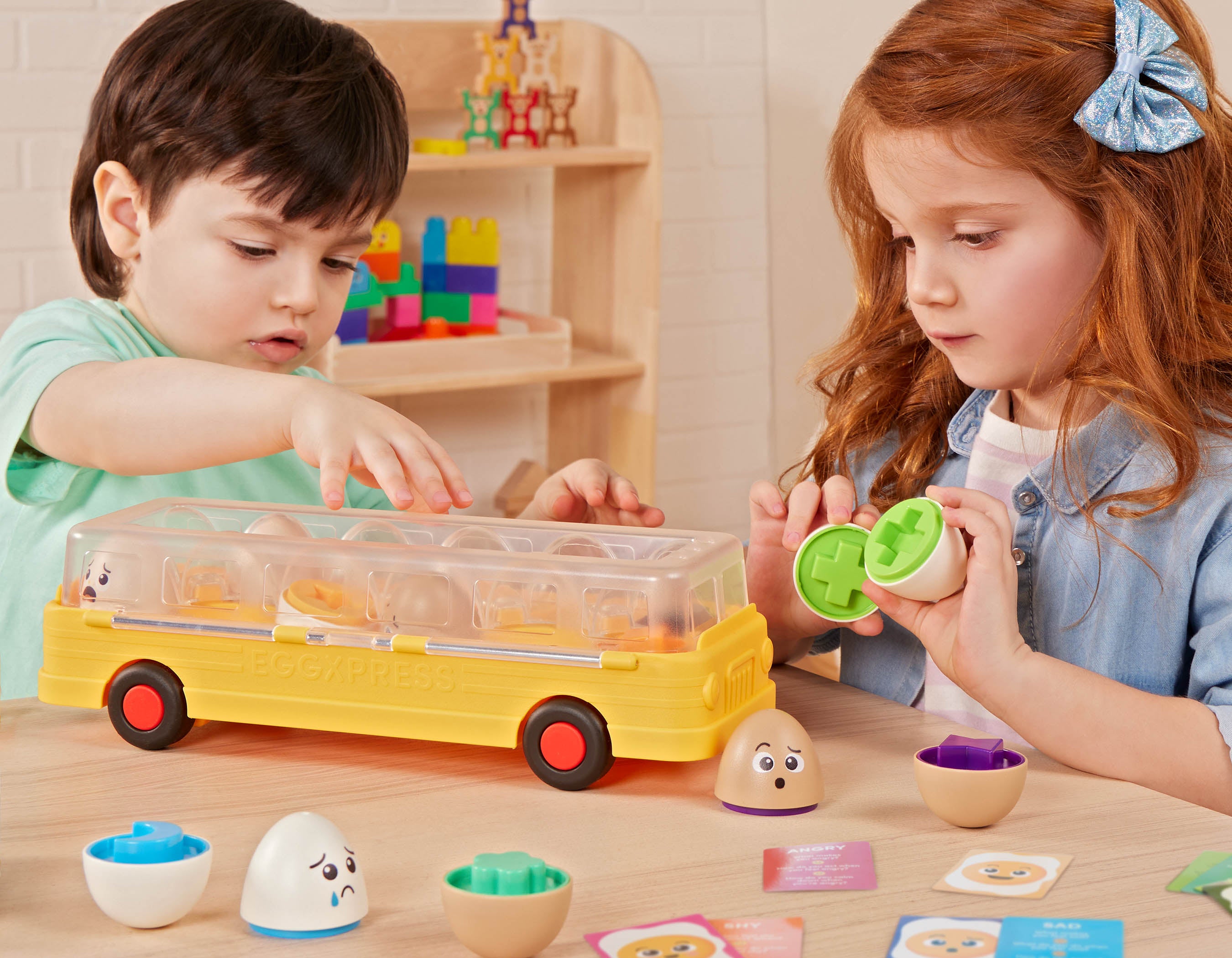 Egg bus playset with cards and a booklet.