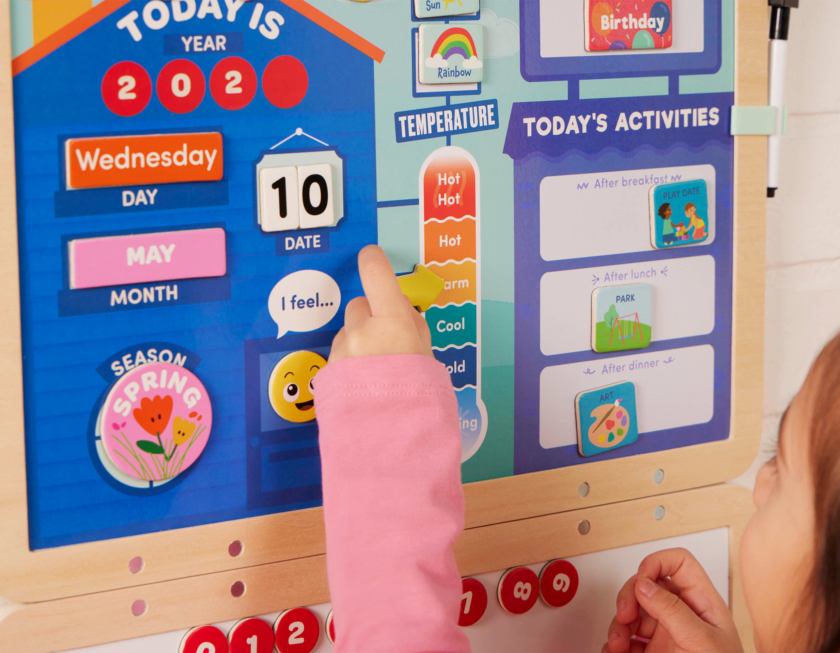 Calendar for kids with magnets, booklet, and dry-erase marker.