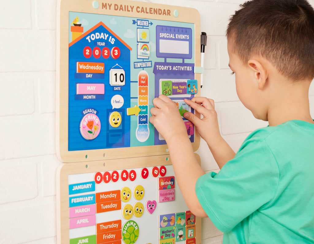 Calendar for kids with magnets, booklet, and dry-erase marker.