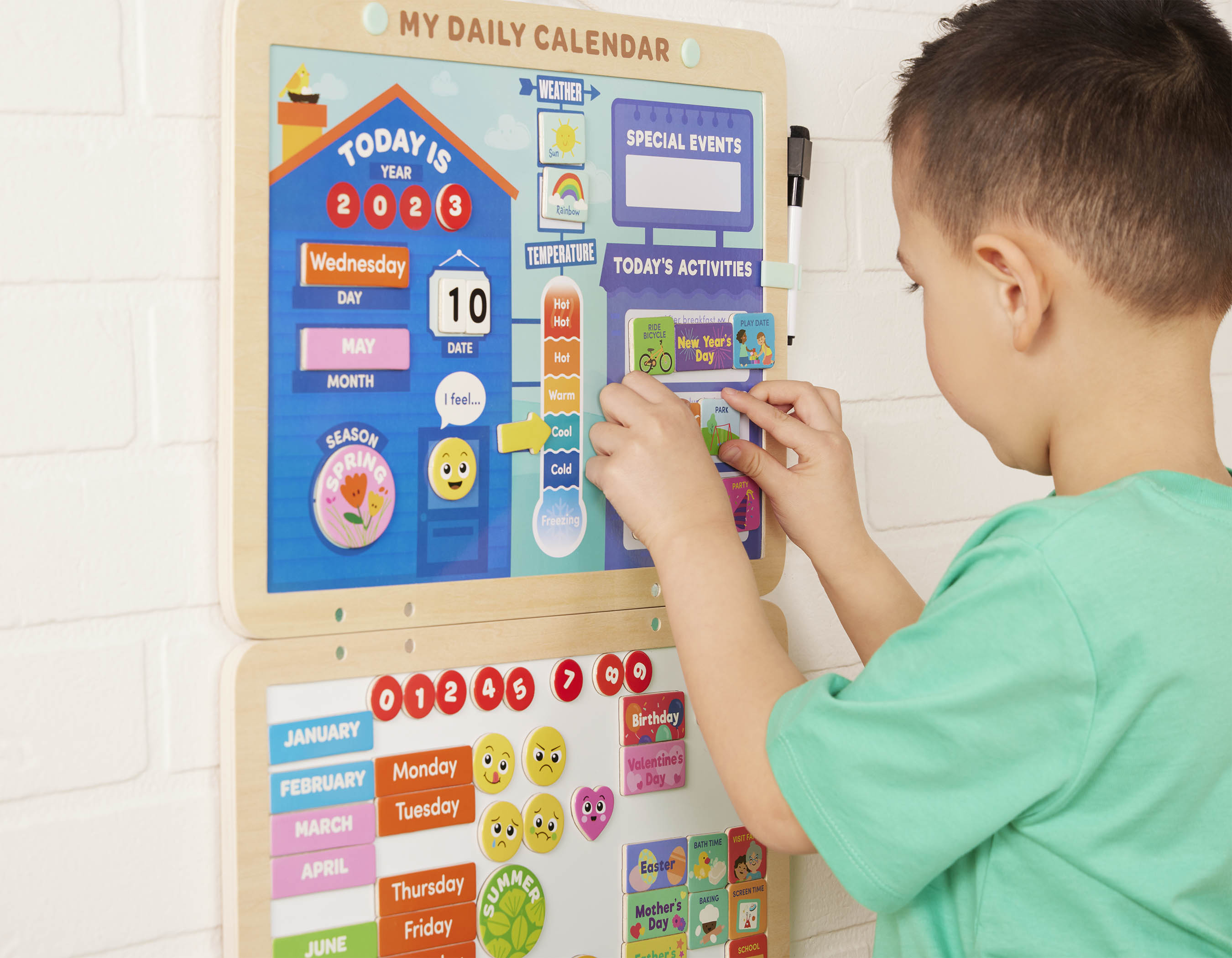 Calendar for kids with magnets, booklet, and dry-erase marker.