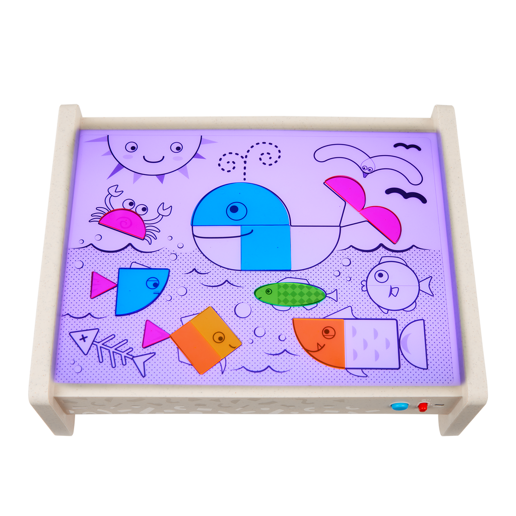 Light box playset with transculent shapes and bugs, tools, and a booklet.