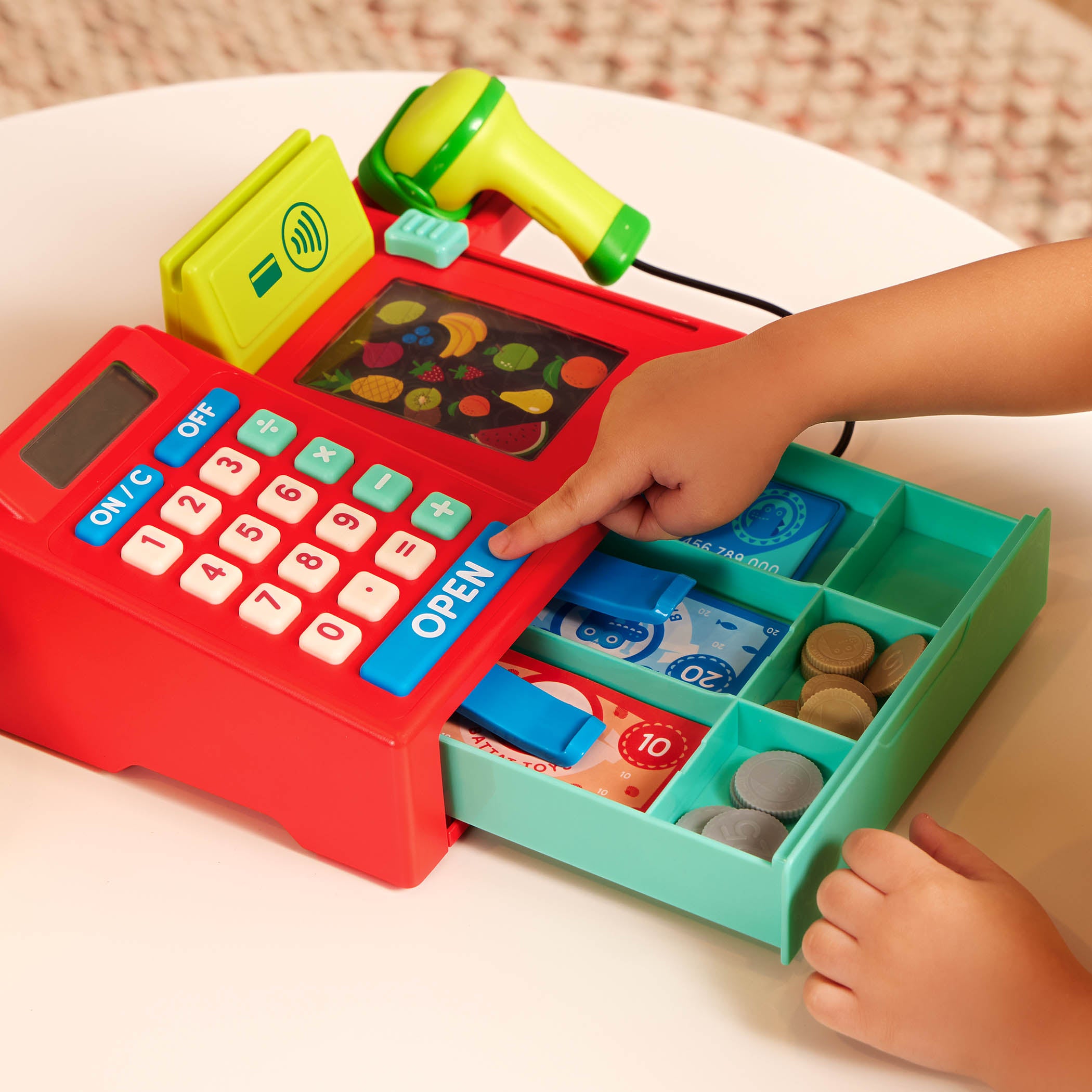 Toy cash register with accessories