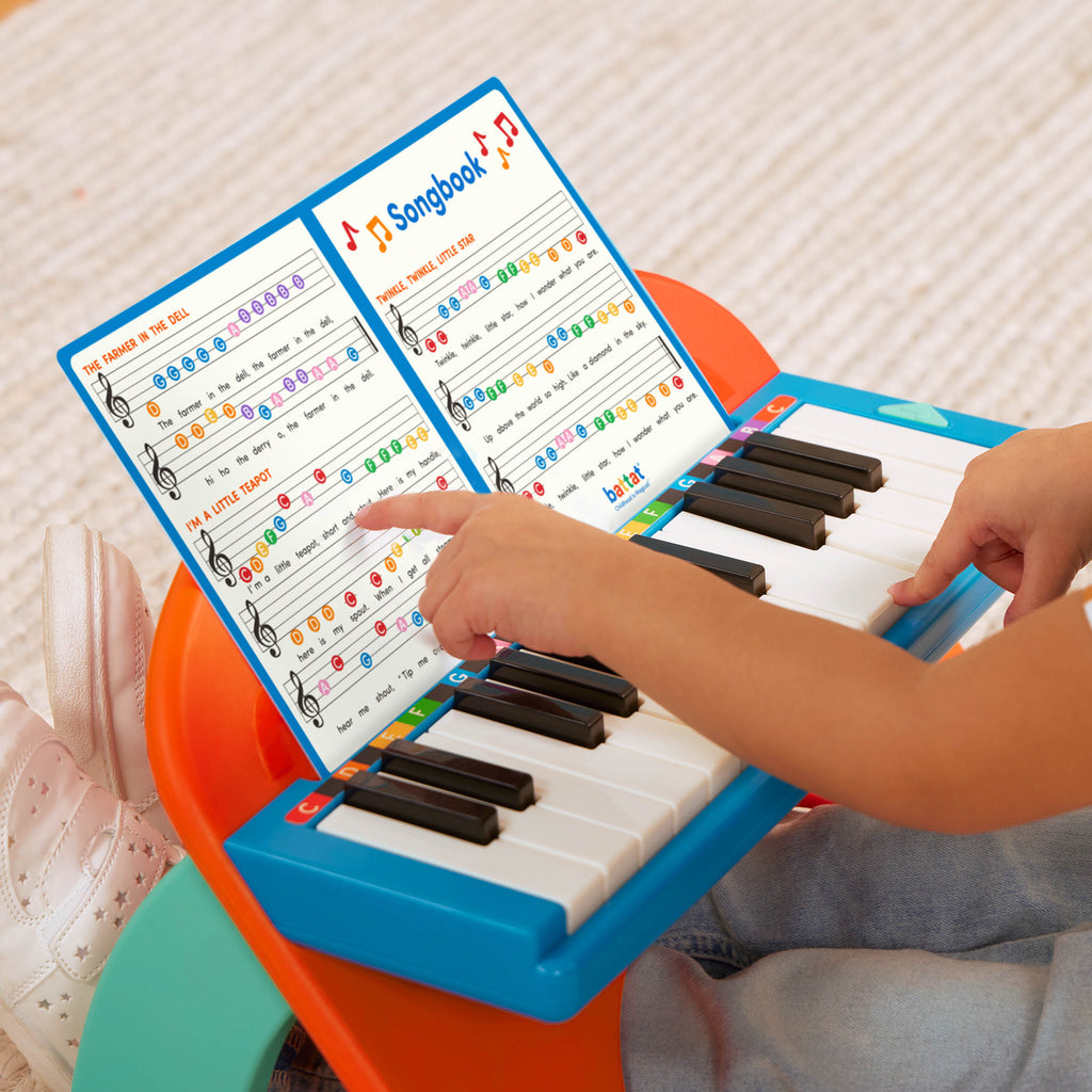 Toy piano and songsheet