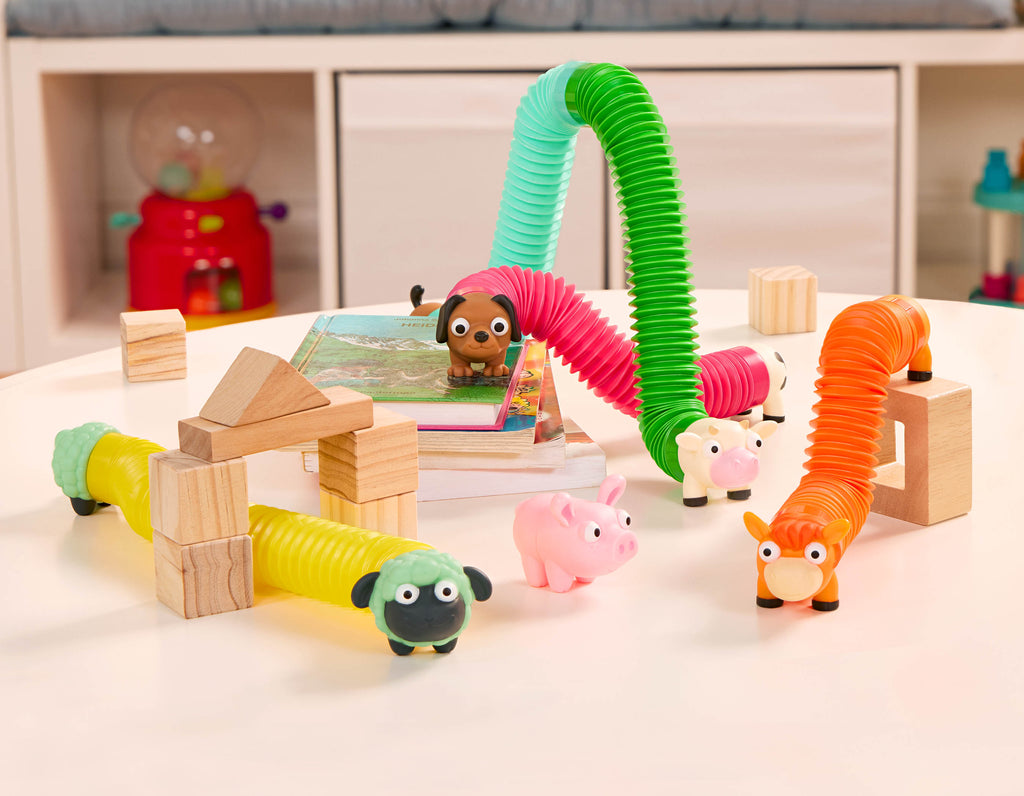 Stretchy toy animals including a horse, a cow, a sheep, a dog and a pig