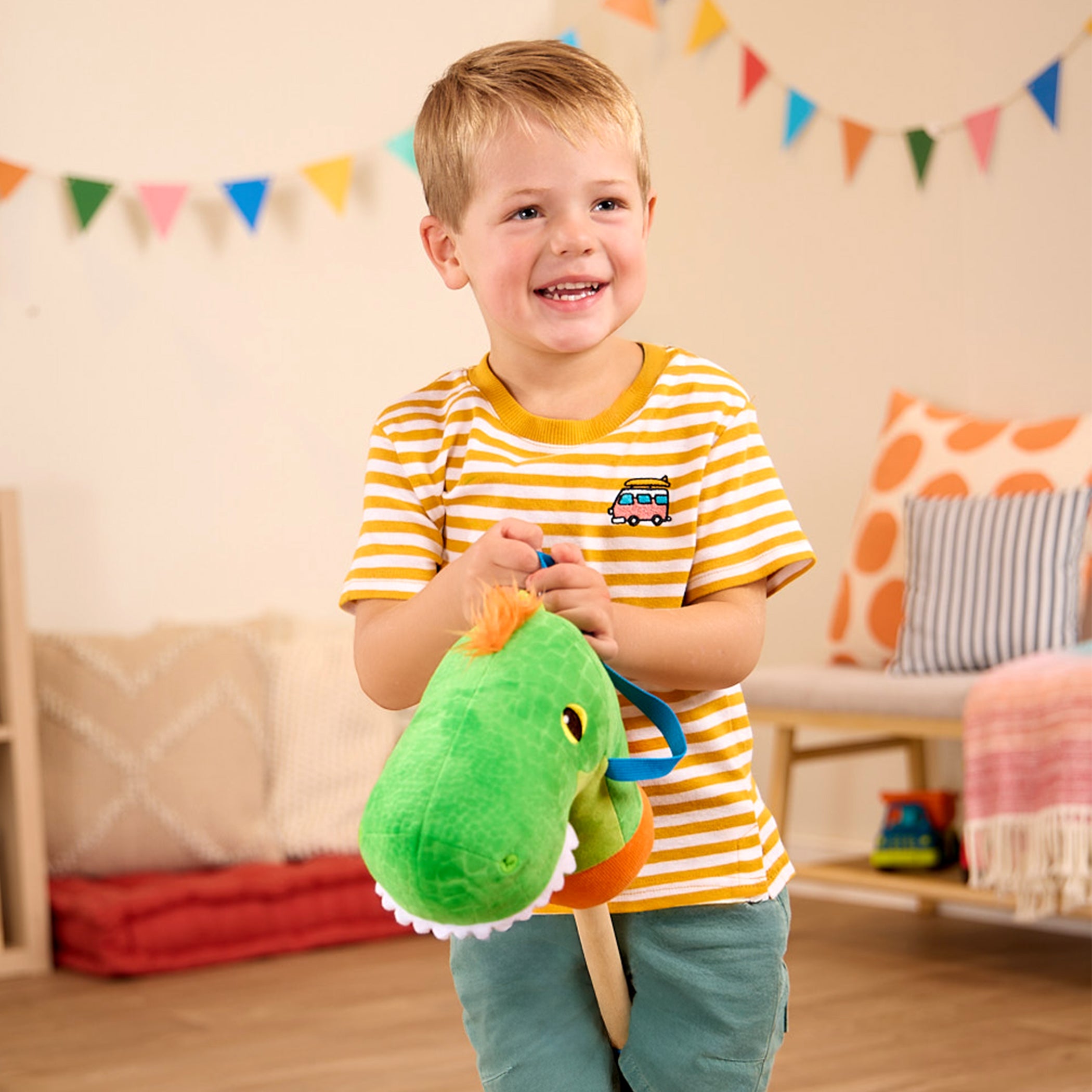green dino hobby horse with wooden riding pole
