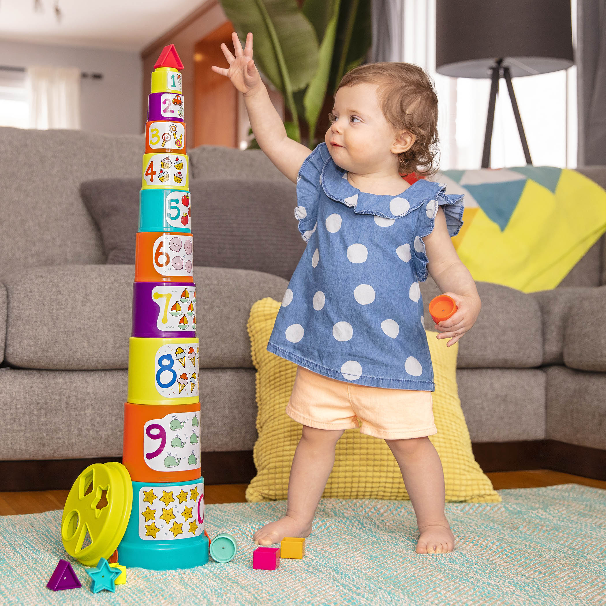 Stacking buckets for toddler with shapes to sort.