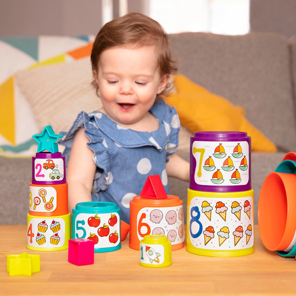 Stacking buckets for toddler with shapes to sort.