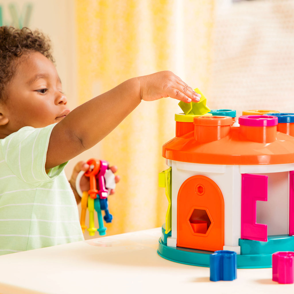 A shape sorter house toy for toddlers and kids.