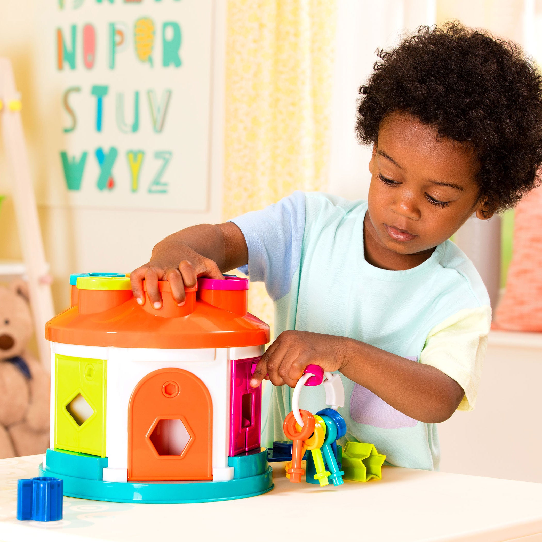 A shape sorter house toy for toddlers and kids.