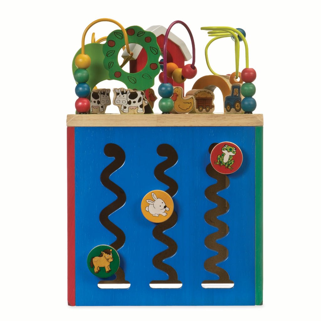 Farm animal activity center with a bead maze on top.