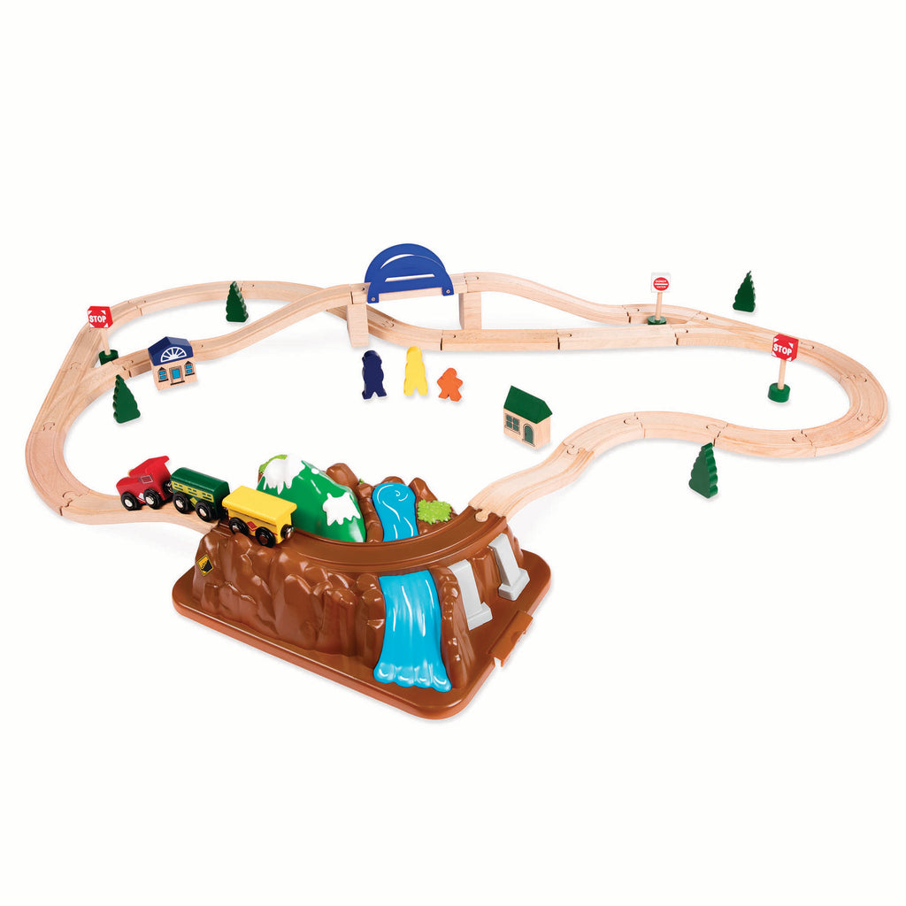 Storage that doubles as a mountain landscape with tracks over a pretend river.