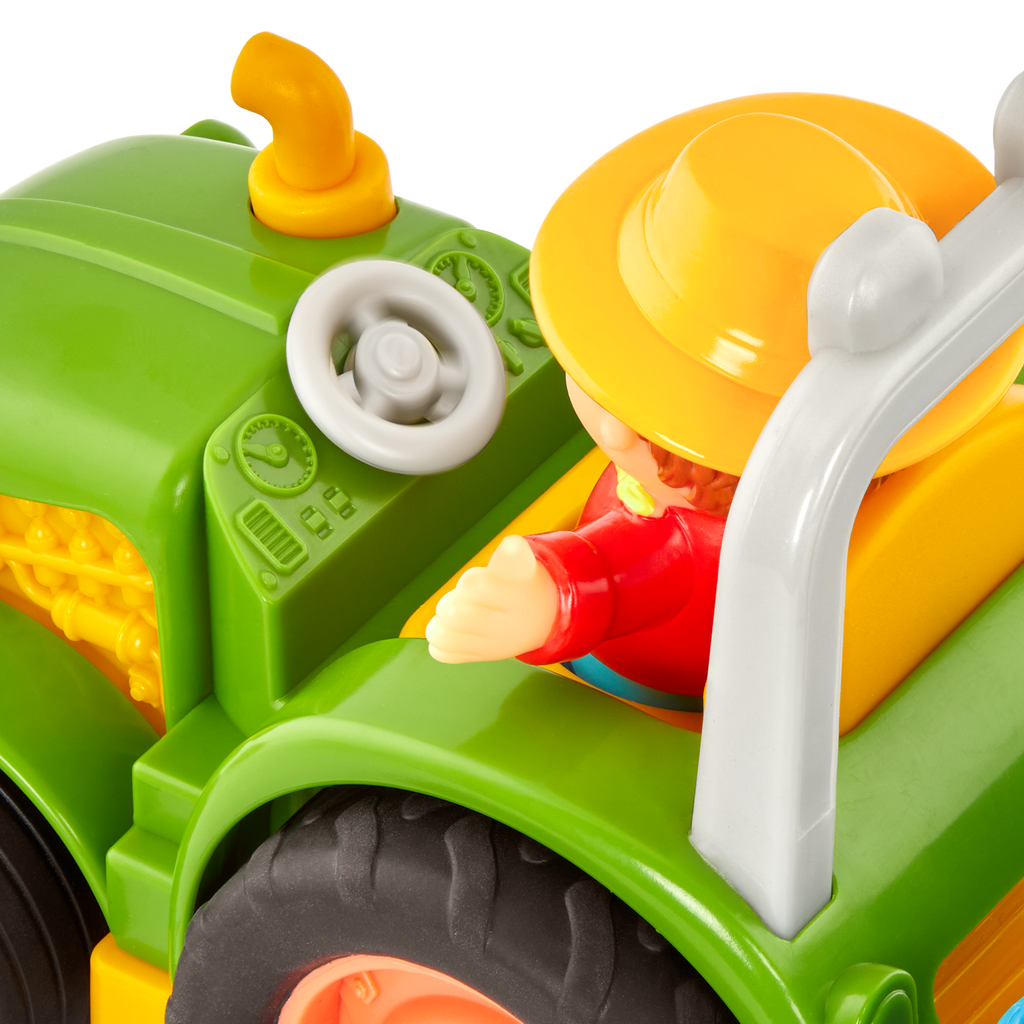 Toy tractor with a farmer and animal figurines.