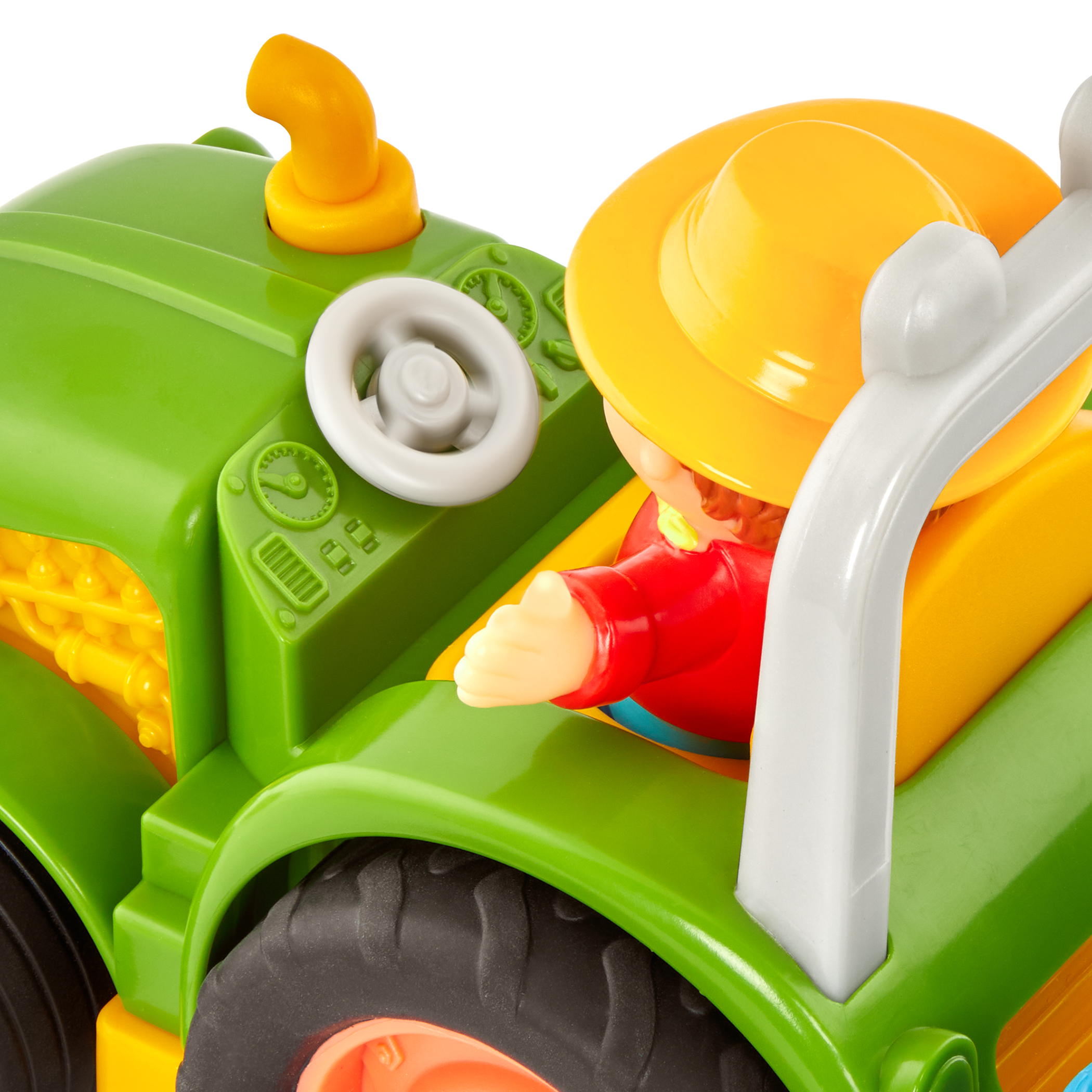 Toy tractor with a farmer and animal figurines.