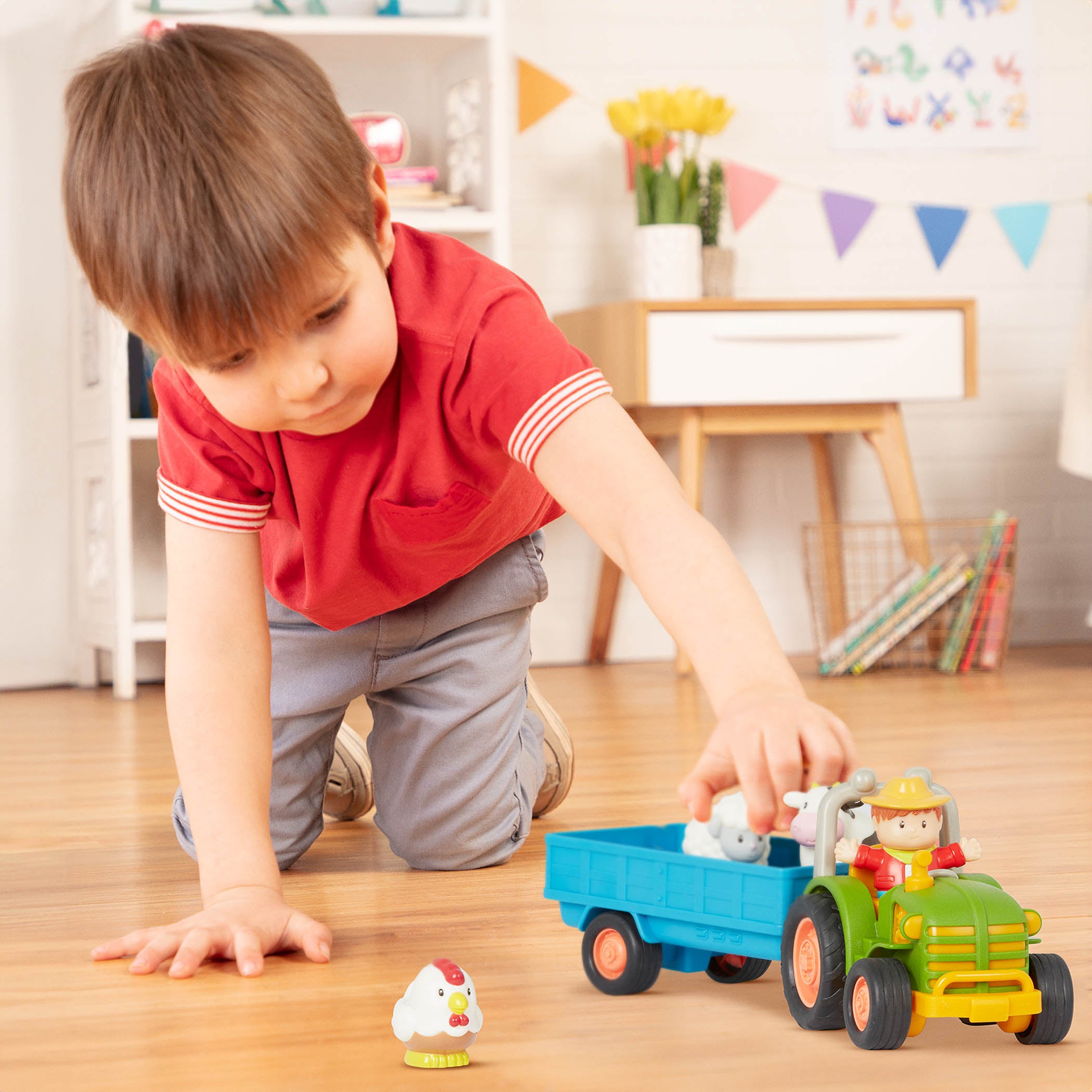 Toy tractor with a farmer and animal figurines.