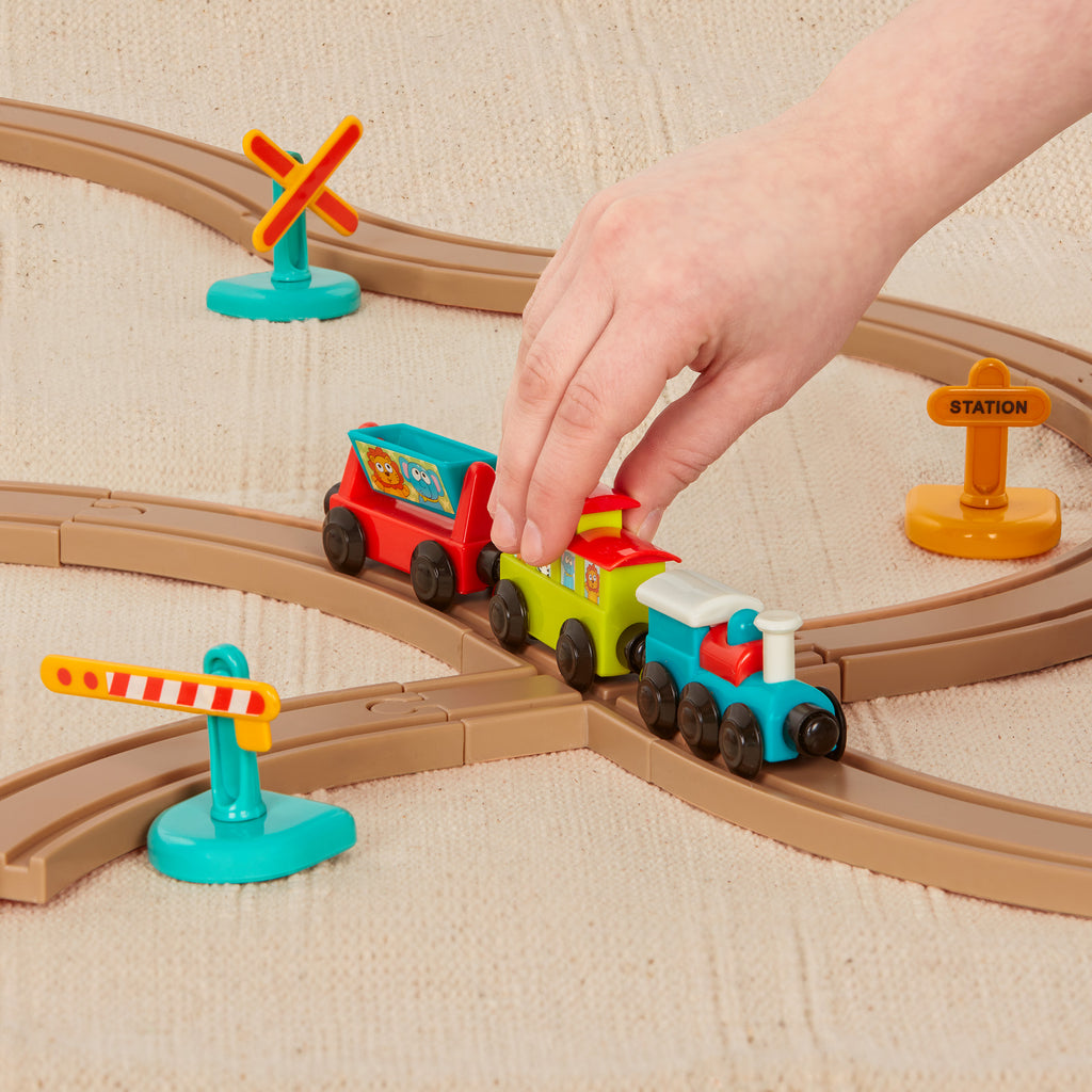 Toy train set with tracks and colorful trains and accessories