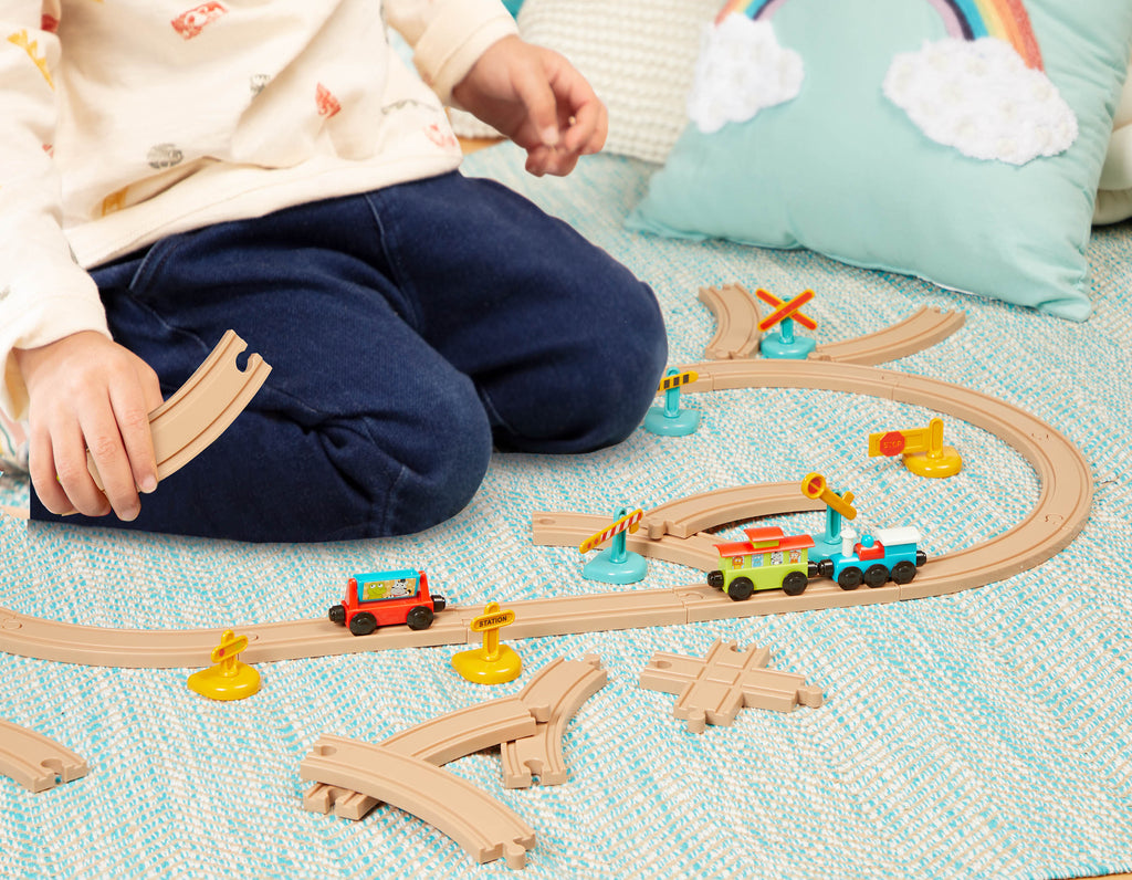 Toy train set with tracks and colorful trains and accessories