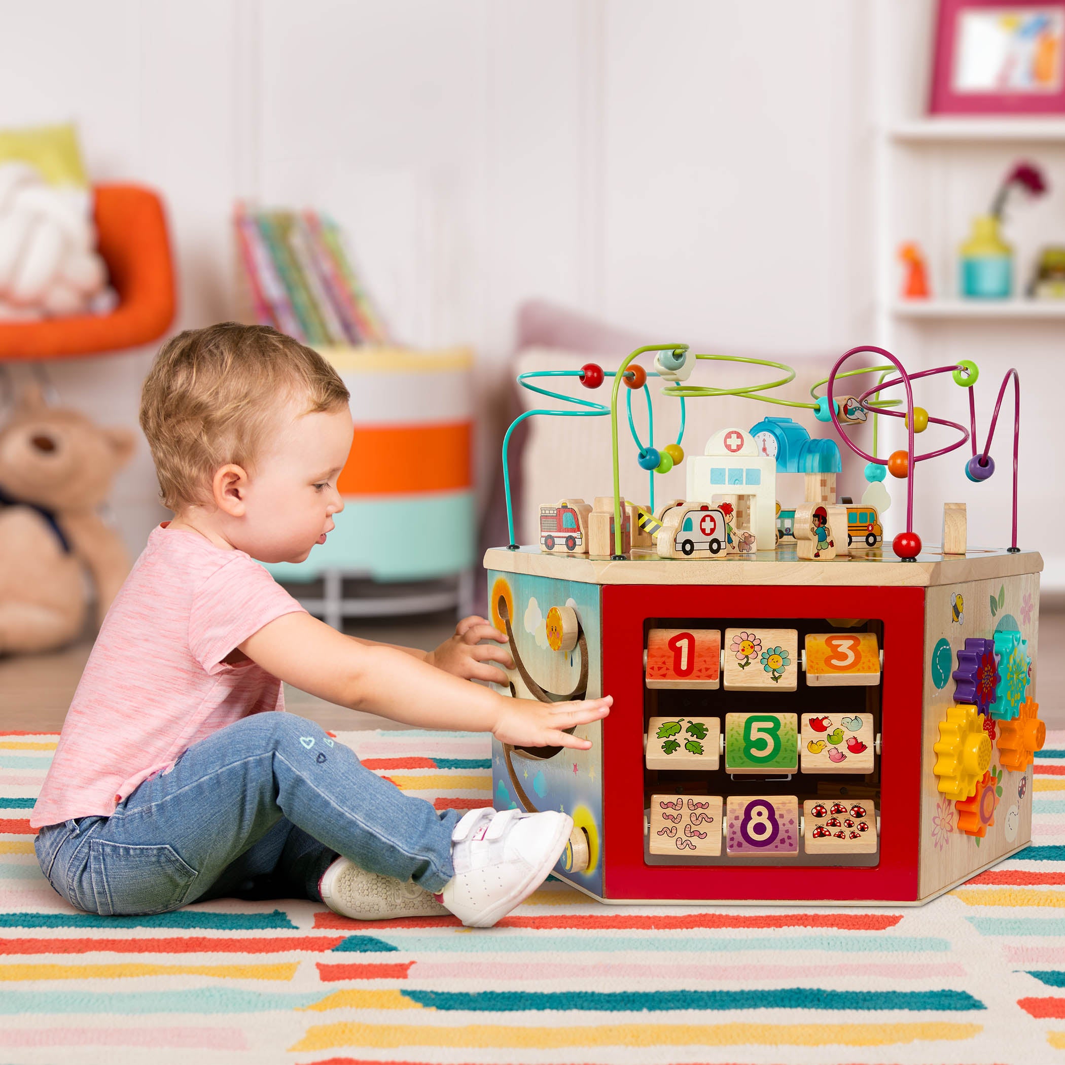 A 7-sided activity cube with a colorful pretend clock.