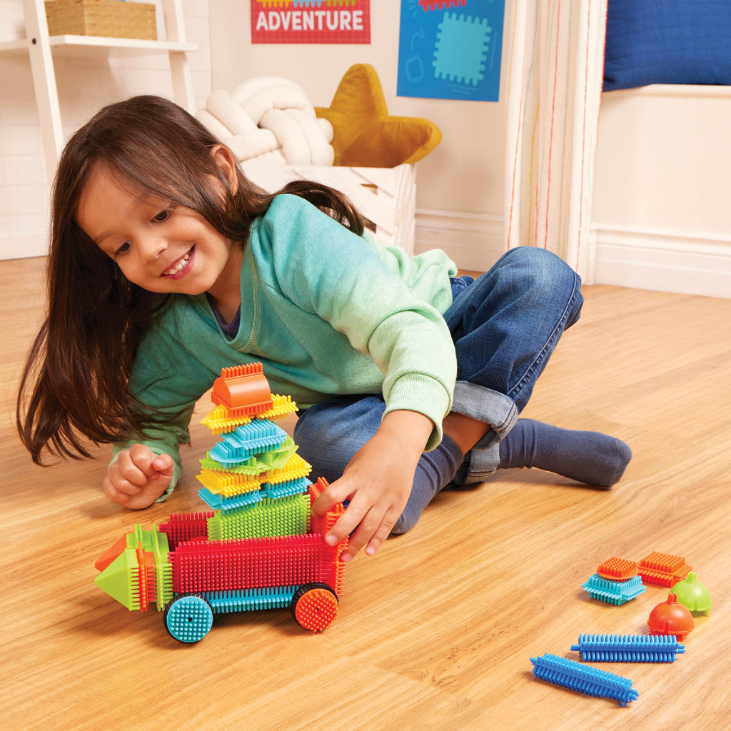 Colorful building blocks laid out, so you can see all the pieces.