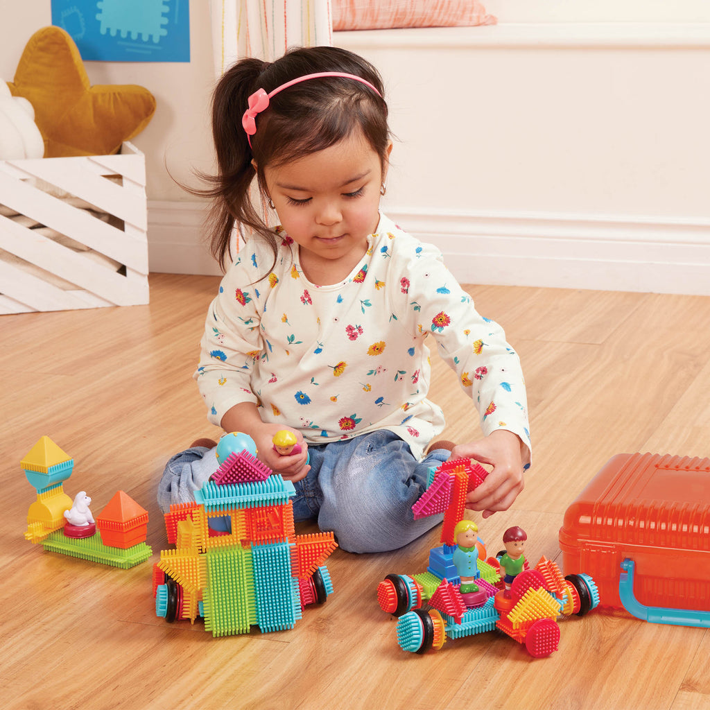 Bristle Blocks laid out to show all the pieces.