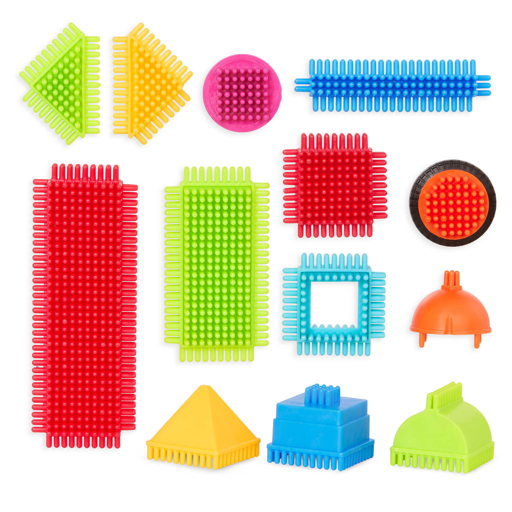 Bristle Blocks laid out in a rainbow pattern.