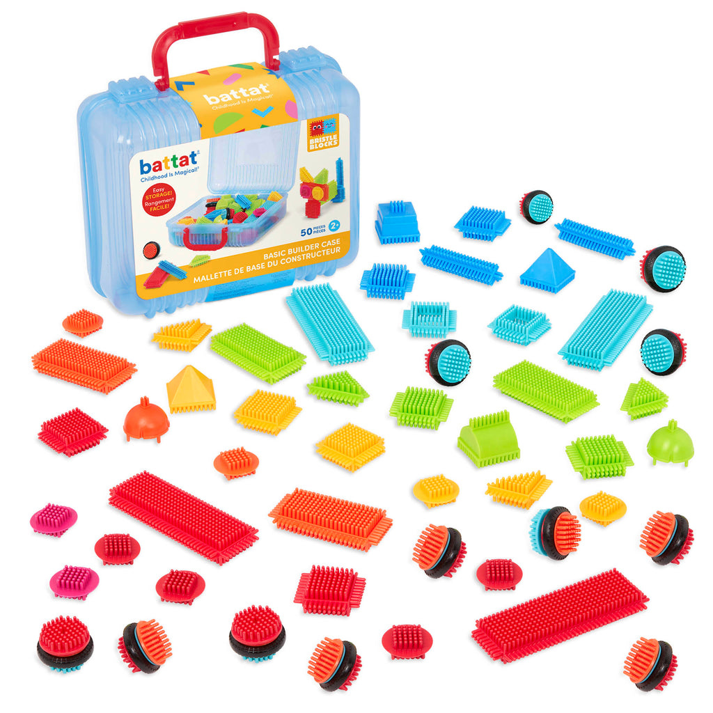 Bristle Blocks laid out in a rainbow pattern.