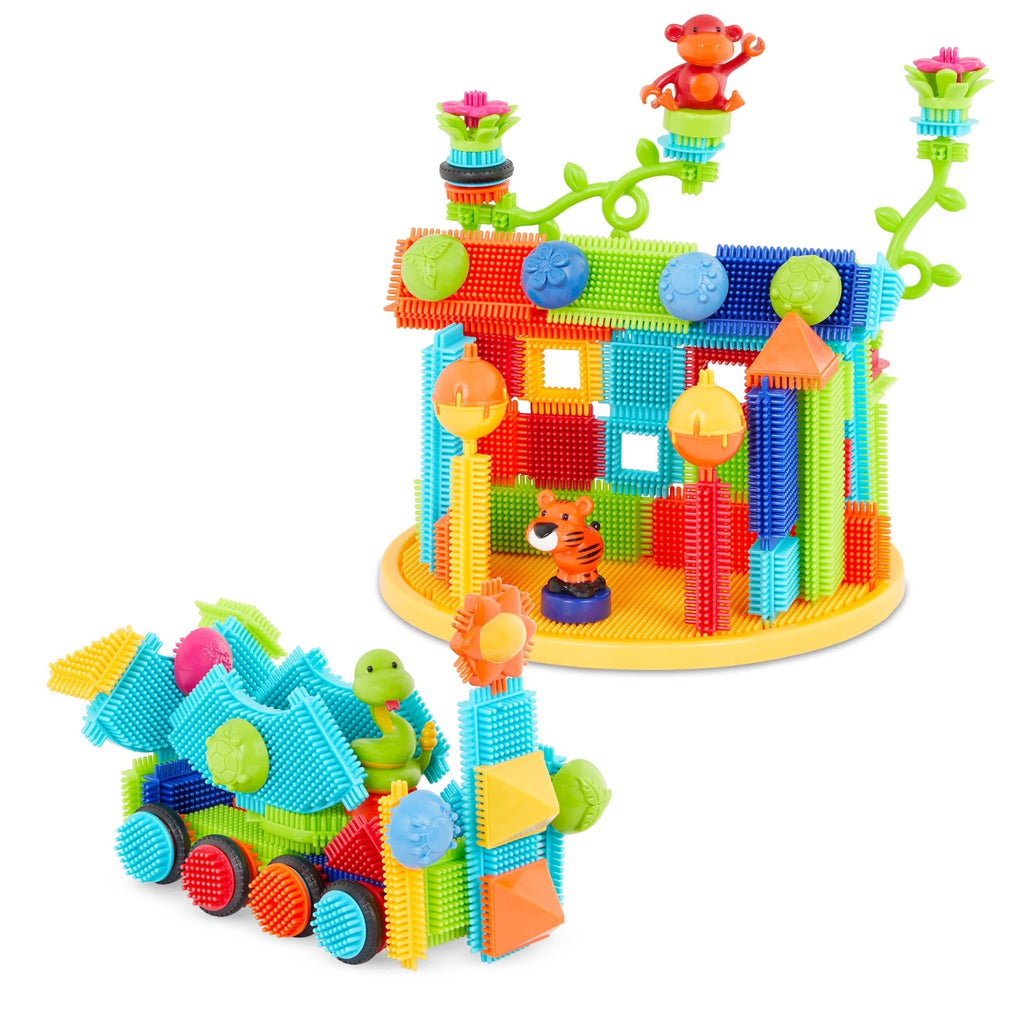 A vehicle and structure made with Bristle Blocks.