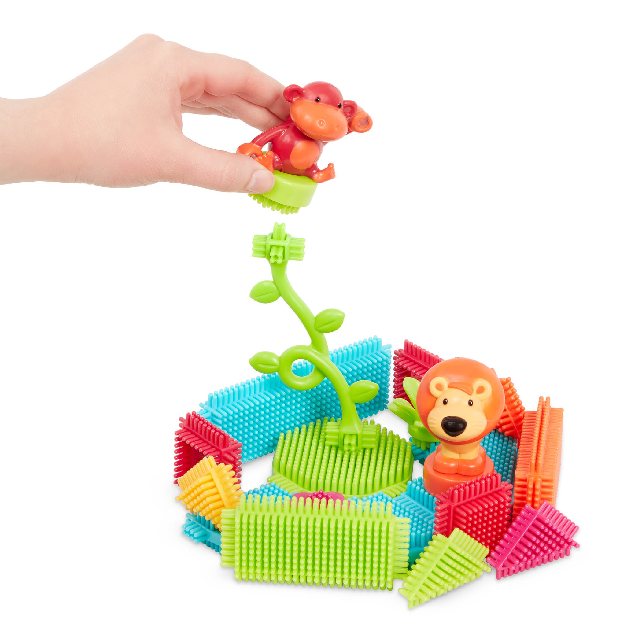 Creations made with Bristle Blocks, including a car with functional wheels.