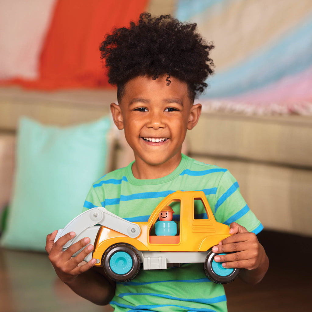 A front end loader toy with the shovel lifted.