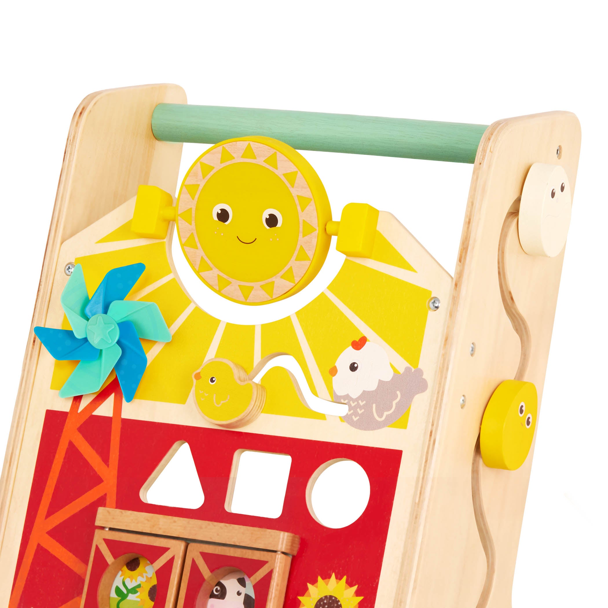 A baby walker toy with blocks and colorful handkerchiefs.