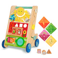 A baby walker toy with blocks and colorful handkerchiefs.