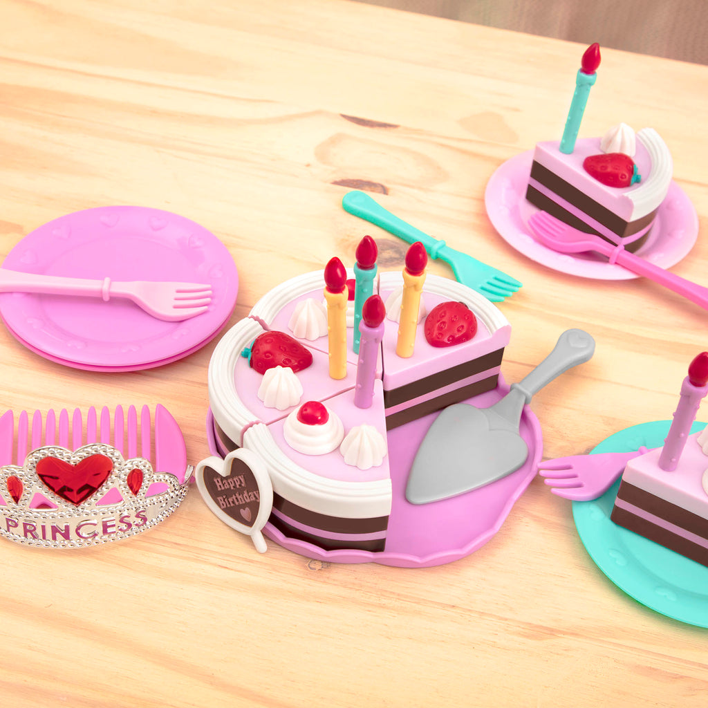 2 slices of pretend birthday cake with candles and utensils.