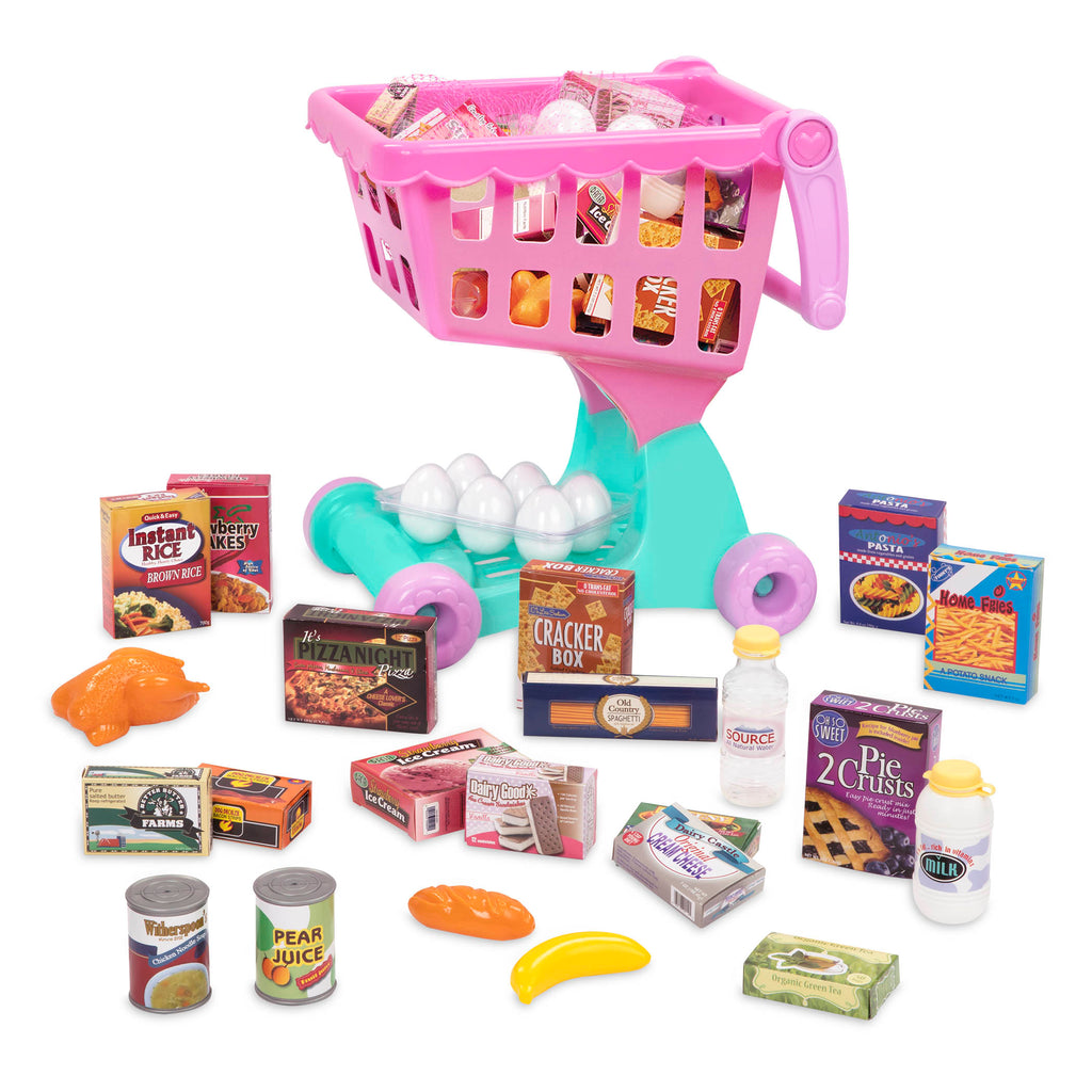 A pink and green toy shopping cart full of groceries.
