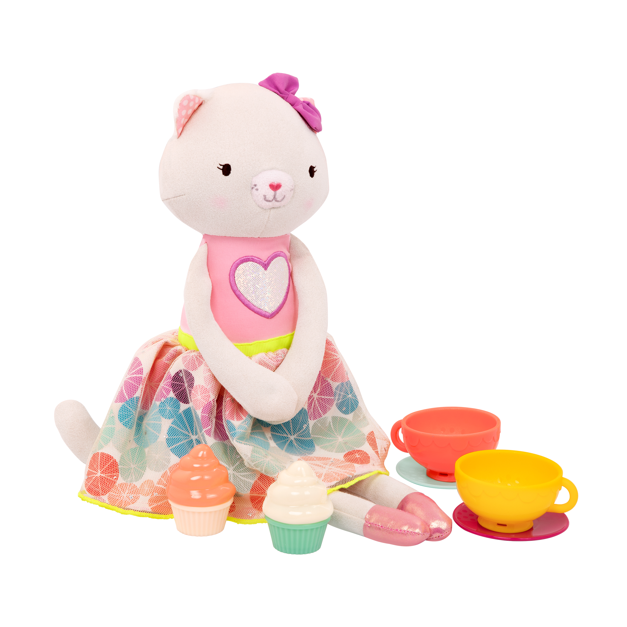 Tea set with plush cat and book.