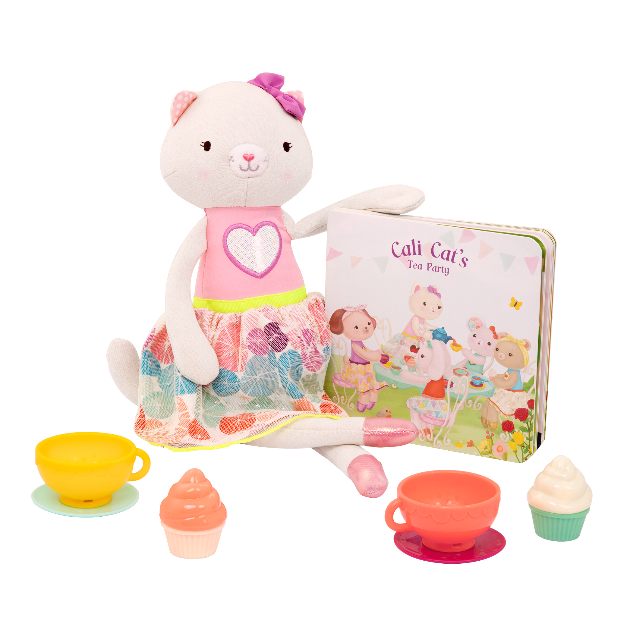 Tea set with plush cat and book.