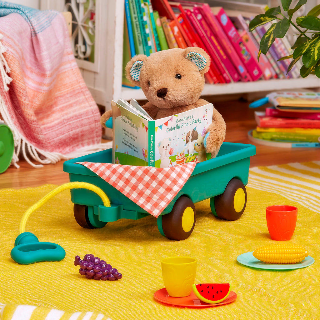 Plush bear with picnic playset and book.