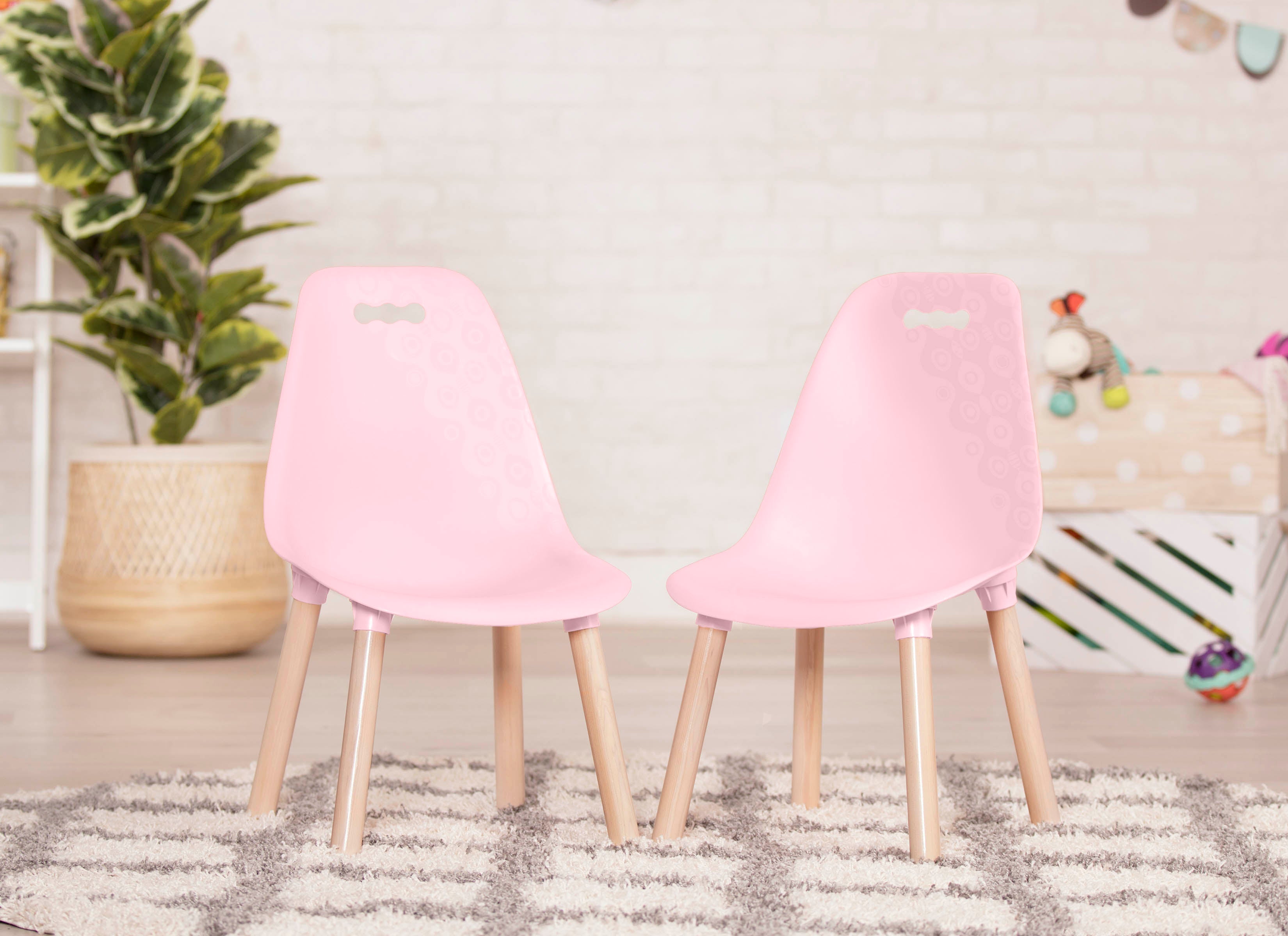 Two pink chairs for kids.