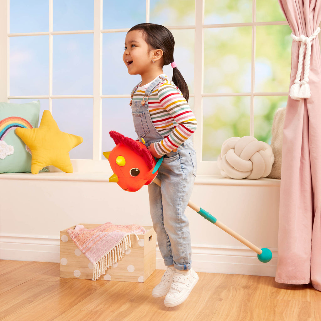 Plush dino hobbyhorse triceratops with wooden stick, sounds, and sensory textures